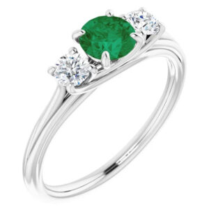 three stone "AA" rated emerald and diamond ring